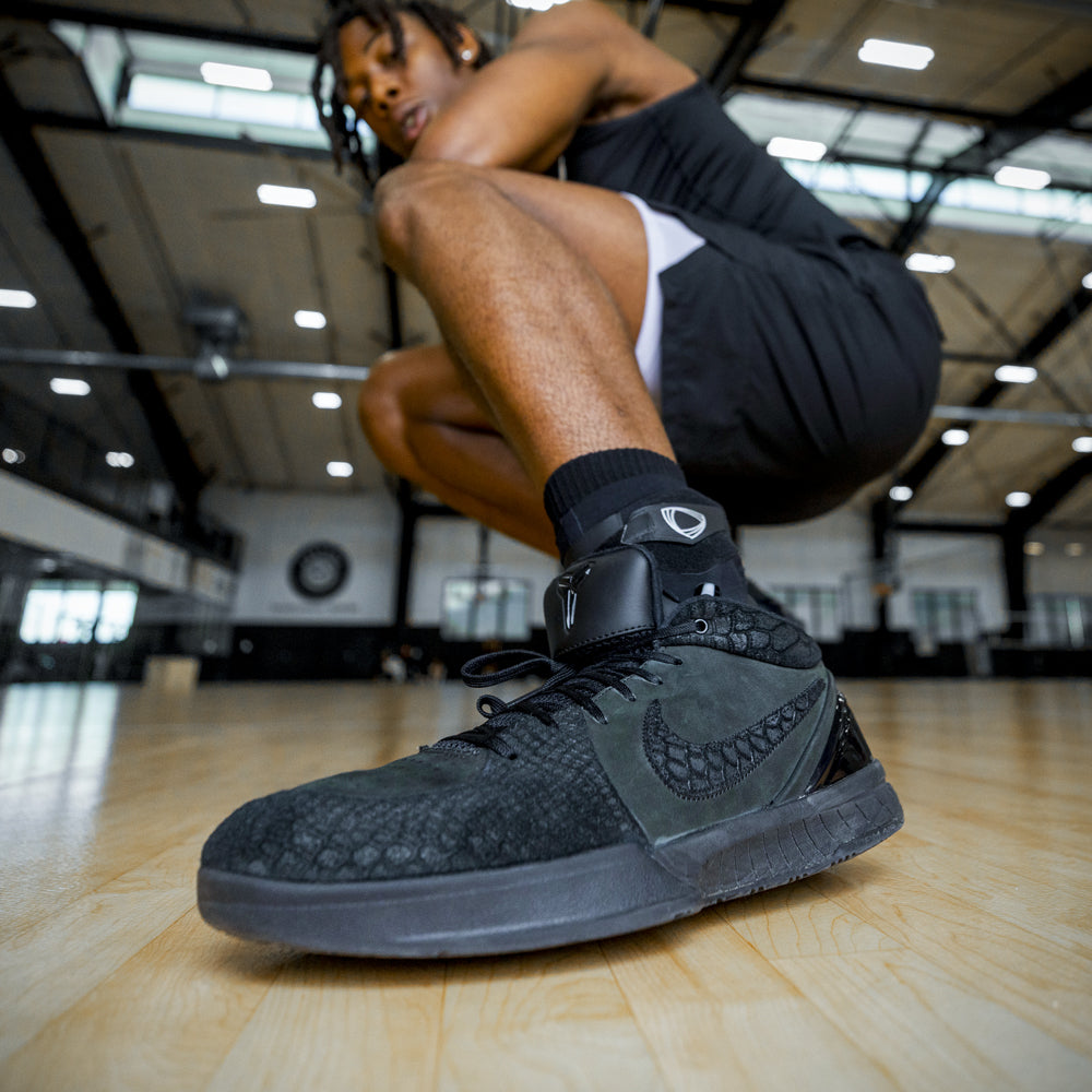Black ankle brace for maximum protection to prevent sprained ankles